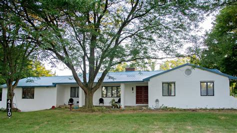 metal roof on off white brick ranch house|brick house metal roof colors.